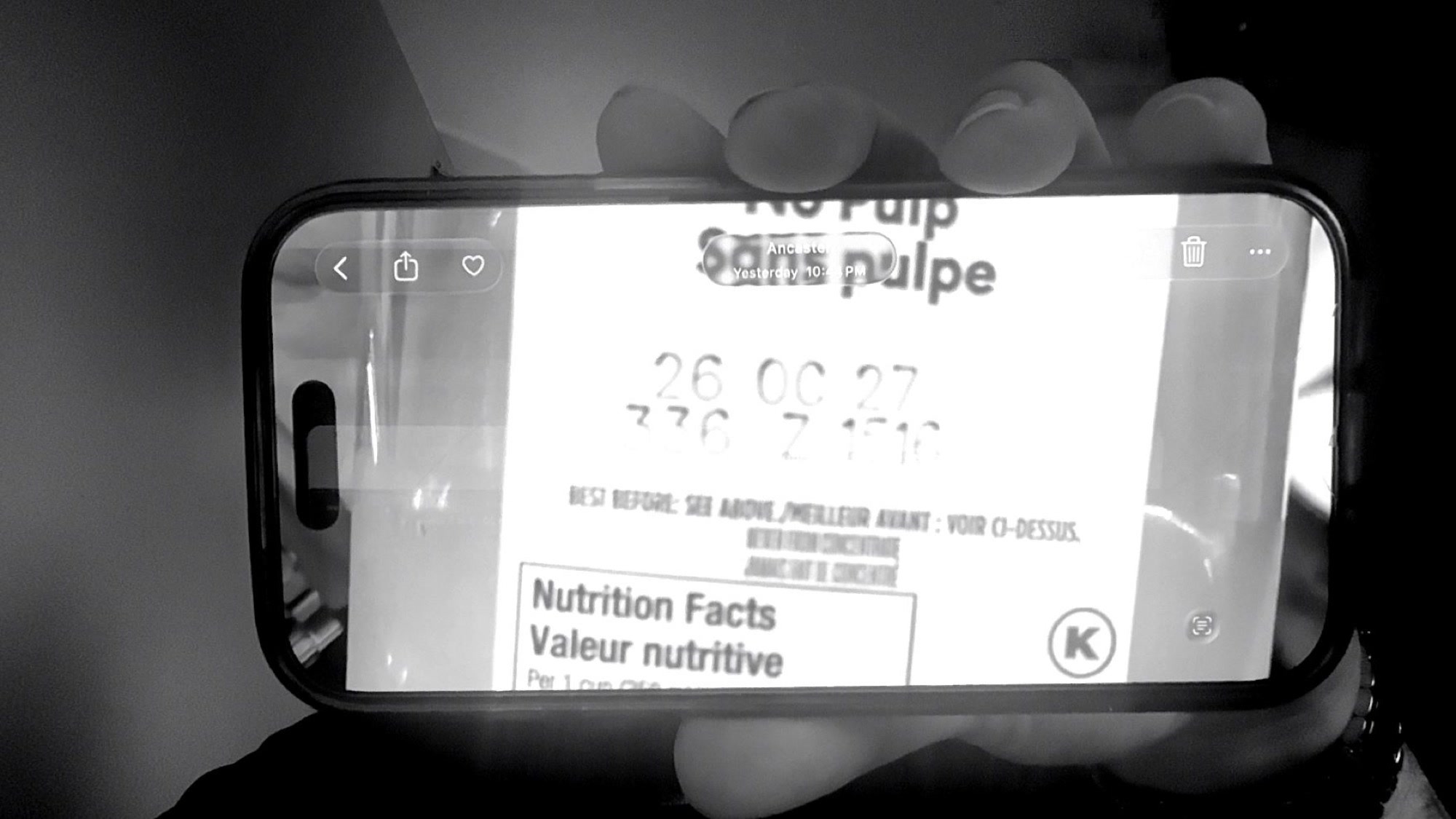 Camera input showing the printed date on an orange juice container.